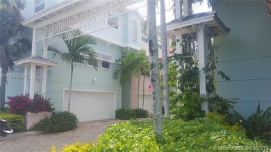 Lushly landscaped arbor at entrance to garage area