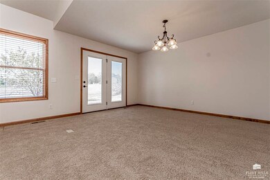 French door leads out to the back yard and patio with a peaceful view and beautiful sunsets.  Deer, Turkey and numerous wildlife can be seen from this vantage point from inside or out.