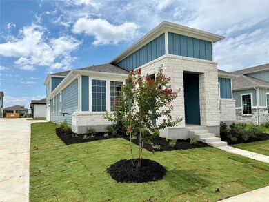 View of front of home featuring board and batten 