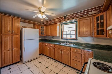 Kitchen with newer cabinets and counter tops.