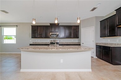 Kitchen with granite and wood cabinets, walk in pa