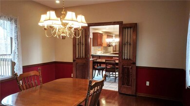 Dining Room with Wrought Iron French Doors