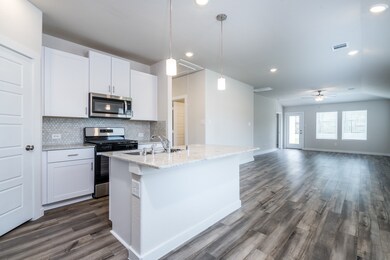 Kitchen opens up to dining area and living room