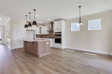 Photos are of a similar home