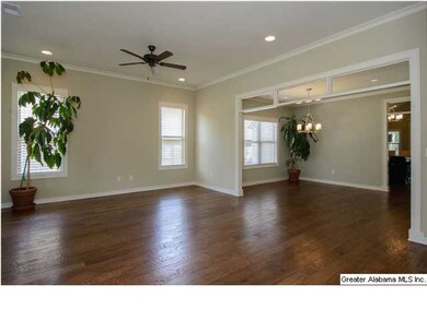 The den opens to the dining room -- glass transoms