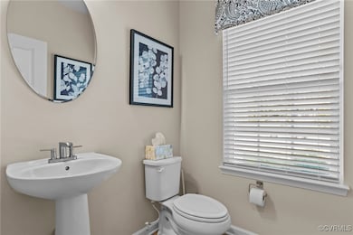 Bathroom featuring baseboards and toilet