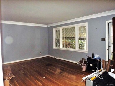 Living Room has double member crown molding and th