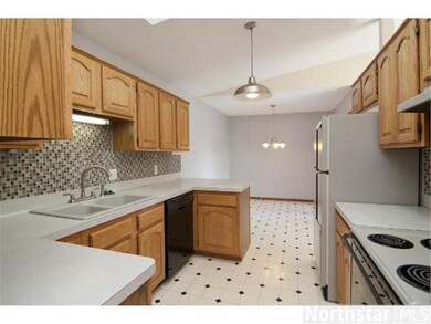 New light fixtures and tile back splash in kitchen