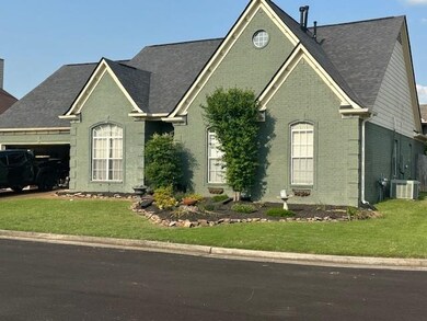 View of front facade featuring brick siding, a garage, a front lawn, central air condition unit, and a shingled roof