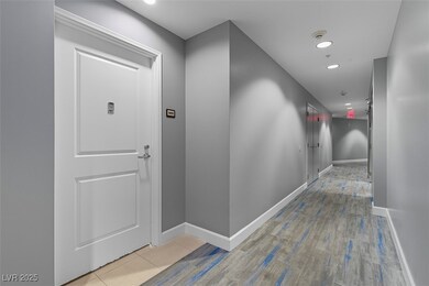 Corridor featuring recessed lighting and light tile patterned flooring