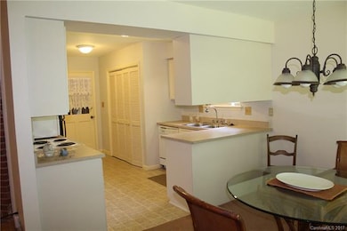 Kitchen area features renovated cabinets, new coun