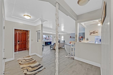 Entrance foyer with wood finish floors, a ceiling