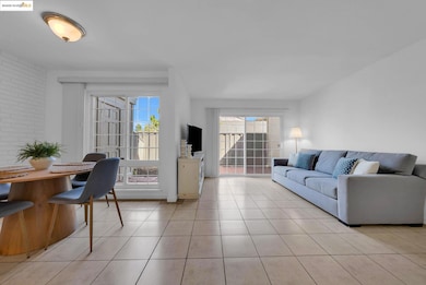 Living room with light tile patterned floors