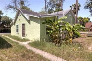 View of side of property with stucco siding