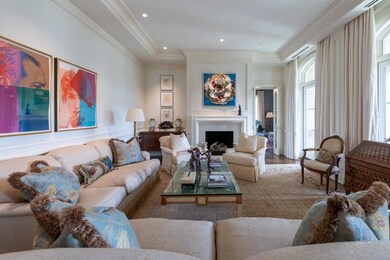 Large formal living room with fireplace and custom