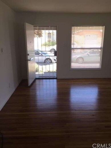 Front door into hardwood floor livingroom