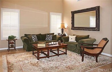 Living Room Windows w/Plantation Shutters And Trav