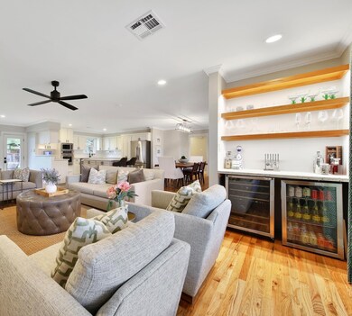 Spacious family room featuring floating shelves an