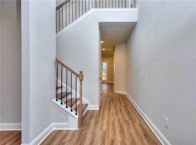 Stairs with LVP finished floors and baseboards