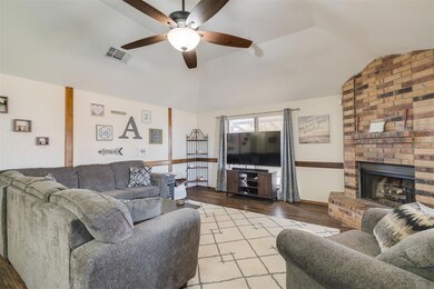 Living room featuring ceiling fan, lofted ceiling,