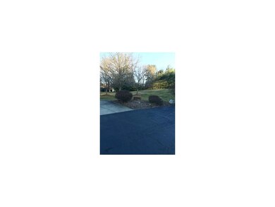 Side yard with parking spaces