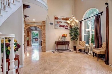 Another view of foyer and access to kitchen and gr