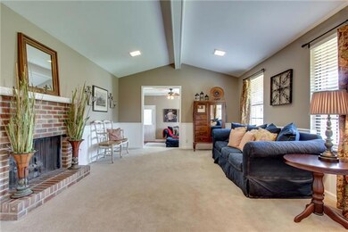 Oversized 20 x 12 Great Room with soaring ceiling, gas fireplace,and new carpet.