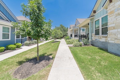 View of community featuring a yard