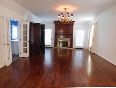 Family room, with French doors to kitchen and acce