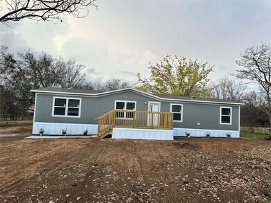 Manufactured / mobile home with a wooden deck