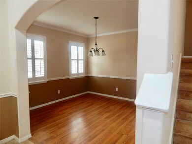 Formal dining room. Notice the plantation shutters!