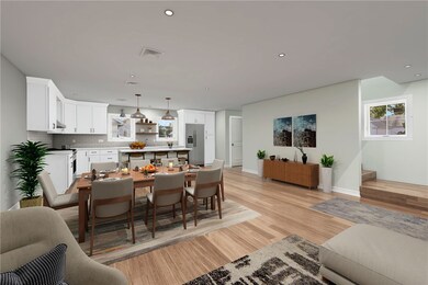 Virtually staged dining and kitchen area.
