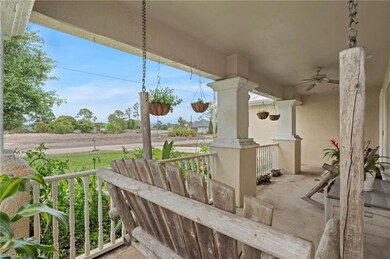 View of patio with ceiling fan and covered porch
