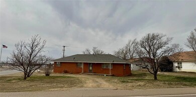 View of front of house featuring brick siding and 