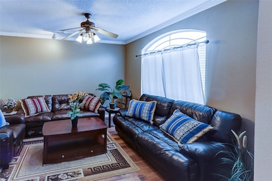 Living room with wood finished floors, ornamental