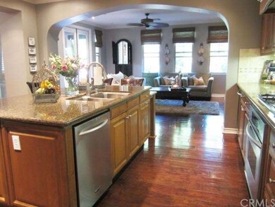 The upgraded kitchen opens into the family room.