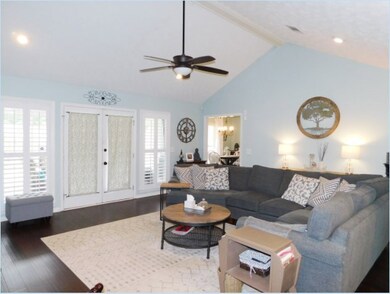 French doors to screened porch and pool