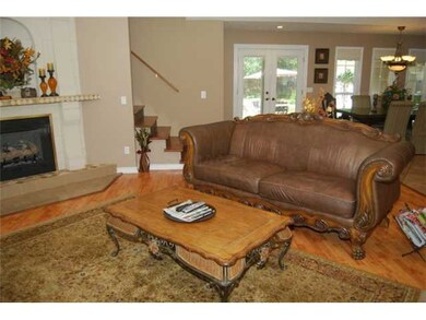Open LR w/custom fireplace, vaulted ceilings w/cei