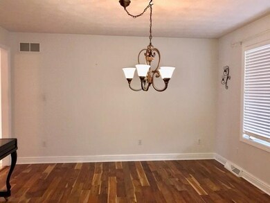 ACACIA hand scraped flooring the entry, dining roo