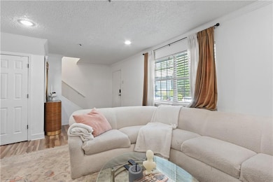 Living room featuring wood finished floors, a text