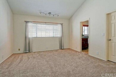Bedroom #2 upstairs with walk in closet, track lighting, vaulted ceilings and a full ensuite bathroom.