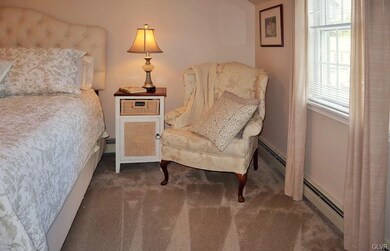 Plenty of room in master for larger furniture and arm chairs.