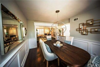 Formal dining room with artistic wood panels, eleg