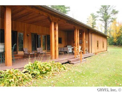 Exterior Back. Rear open lanai style back covered 