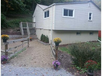 Exterior Front. Access the home via a pleasant wid
