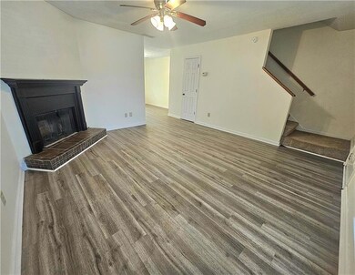 Unfurnished living room with baseboards, a firepla
