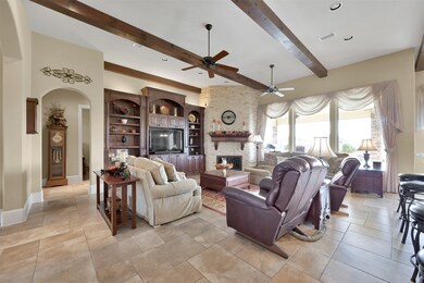 The large family room with high exposed beam ceili