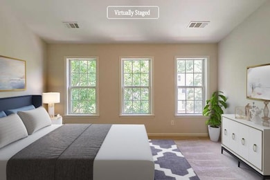 Bedroom featuring baseboards and visible vents