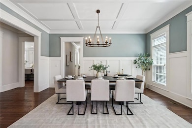 Entrance foyer with stairs, crown molding, baseboards, and dark wood-style floors
