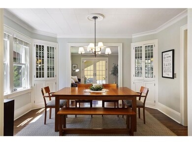The elegant formal dining room is accented with lo